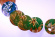 Glasunderlägg med motiv från Golvur, blomma och palm